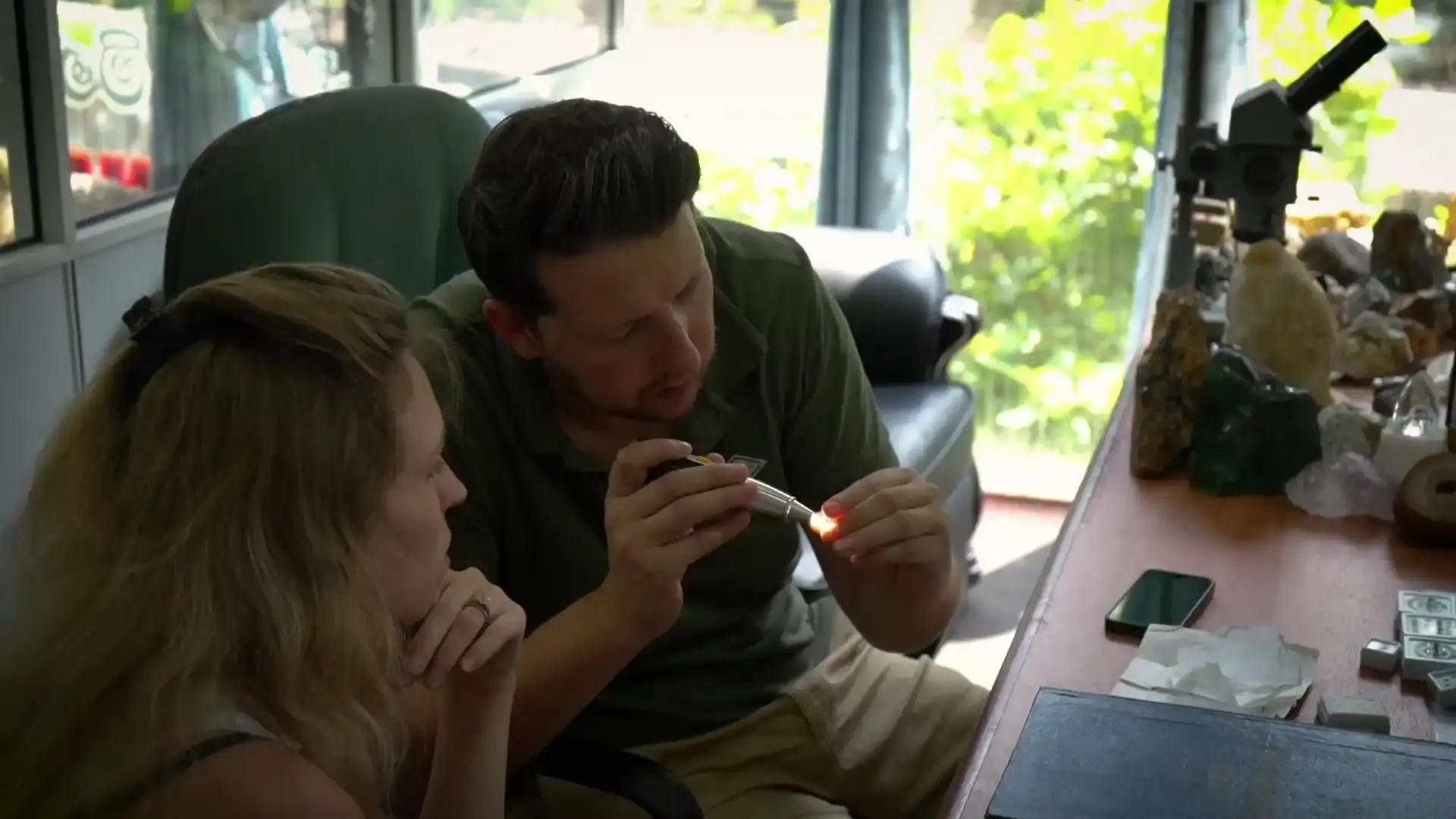 Tourist washing gem gravel in a traditional basket during a Ratnapura gem mine tour